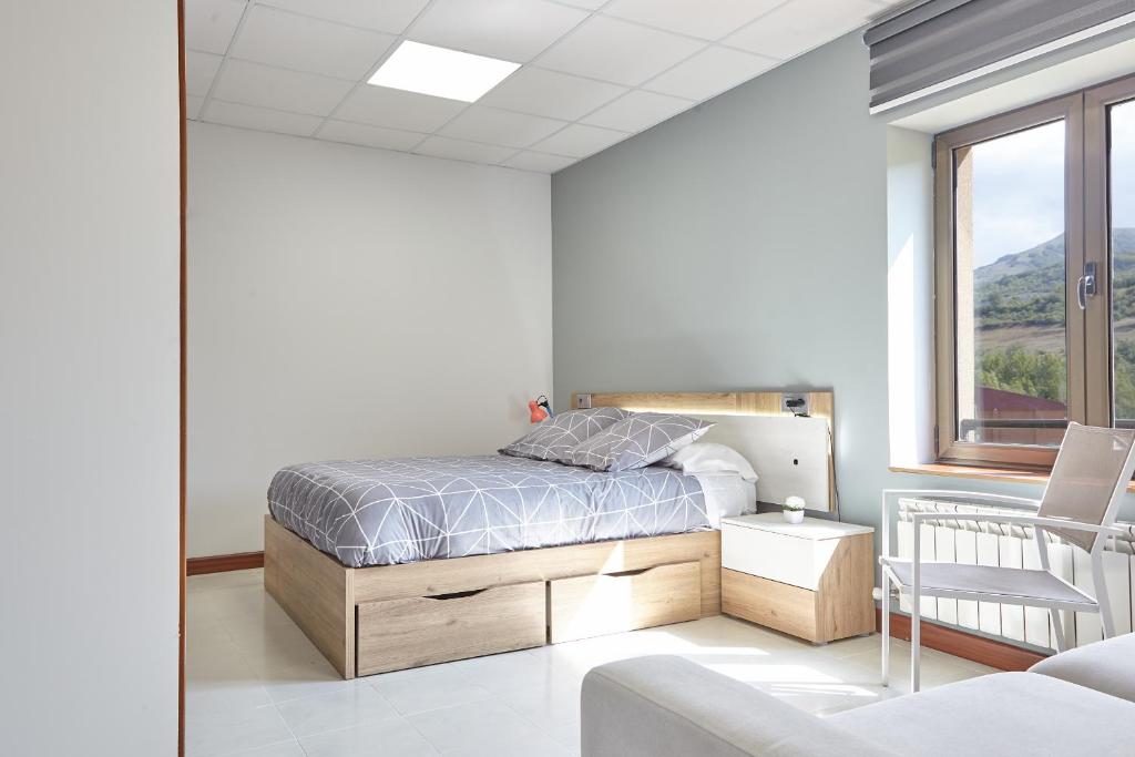 Postel nebo postele na pokoji v ubytování HOSTAL FONTAÑAN