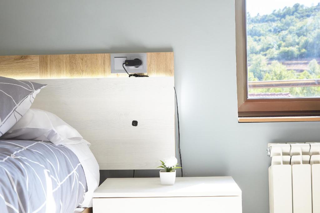 Postel nebo postele na pokoji v ubytování HOSTAL FONTAÑAN