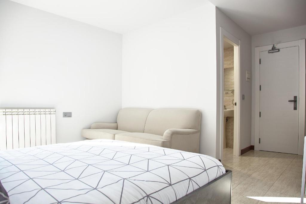 Postel nebo postele na pokoji v ubytování HOSTAL FONTAÑAN