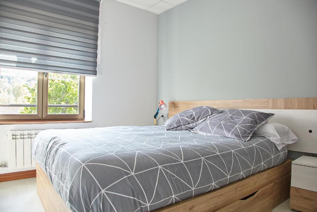 Postel nebo postele na pokoji v ubytování HOSTAL FONTAÑAN