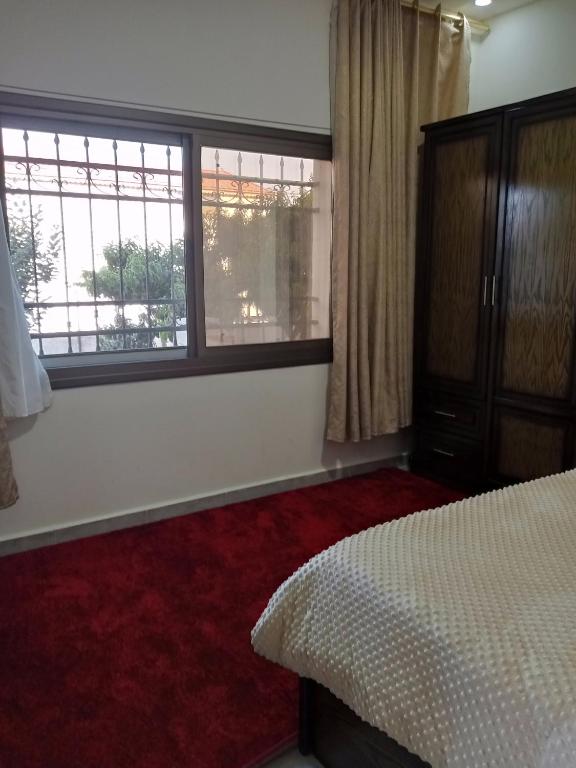 Postel nebo postele na pokoji v ubytování Jerash air apartment