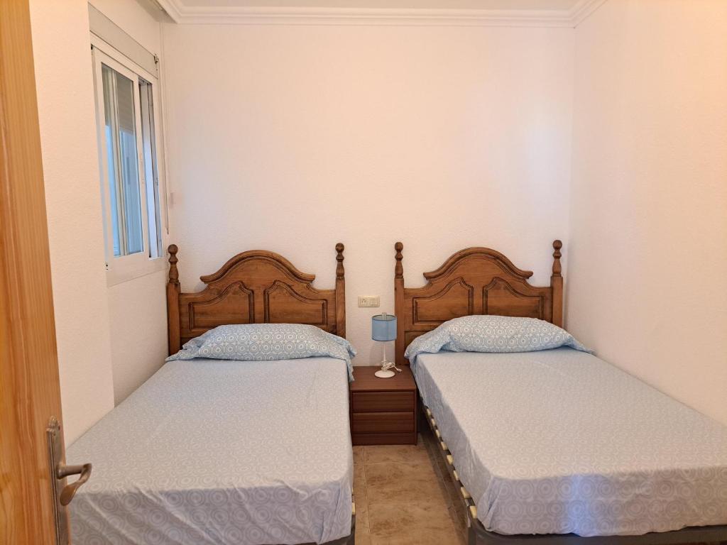 Postel nebo postele na pokoji v ubytování Apartamento Paseo del Malecón - Garrucha