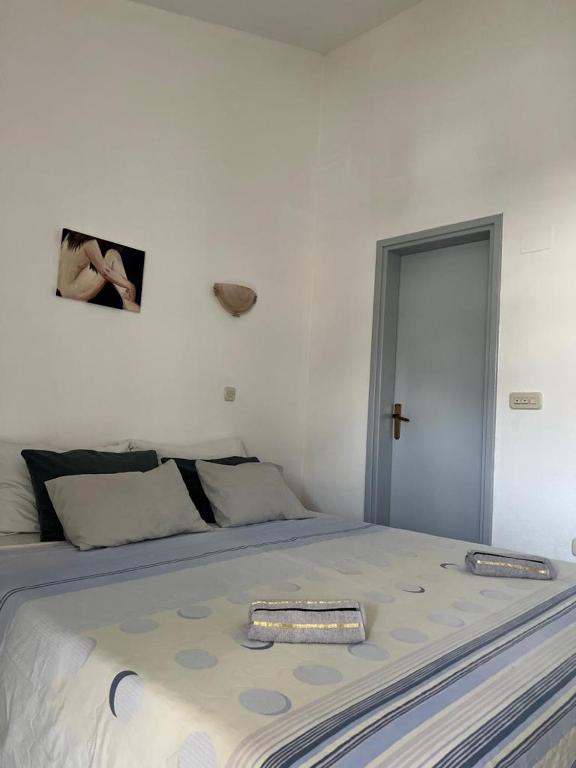 Postel nebo postele na pokoji v ubytování apartmani Natali