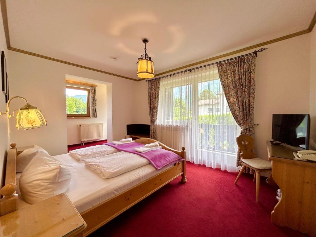 Postel nebo postele na pokoji v ubytování Hotel Bergland