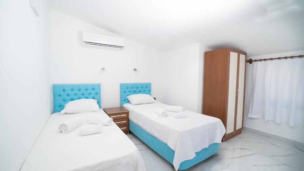 Postel nebo postele na pokoji v ubytování Villa Kübra