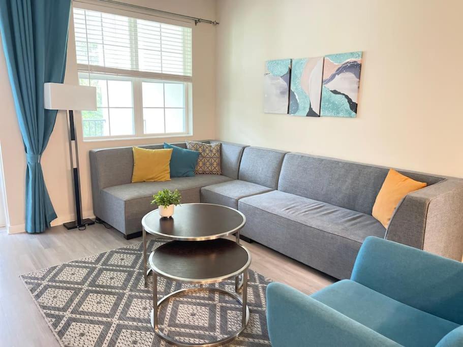 a living room with a couch and a table at Vista Cay Condo near Conventional Center Universal, See world, Disney 8 in Orlando