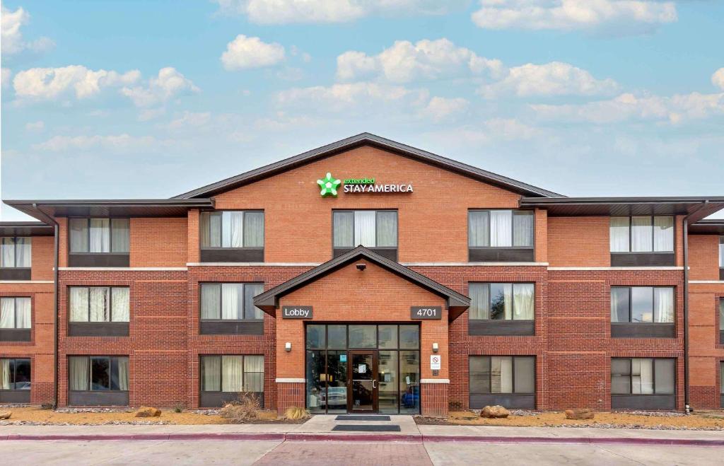 a red brick building with a star on the top at Extended Stay America Suites - Fort Worth - Southwest in Fort Worth