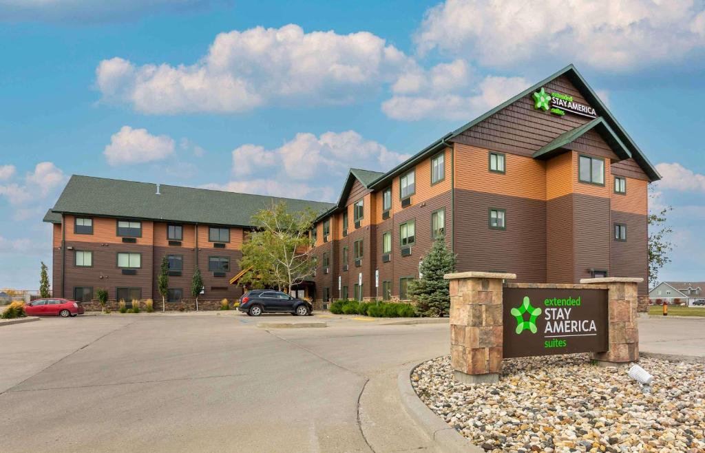 a hotel with a sign in front of a building at Extended Stay Americas Suites - Minot in Minot