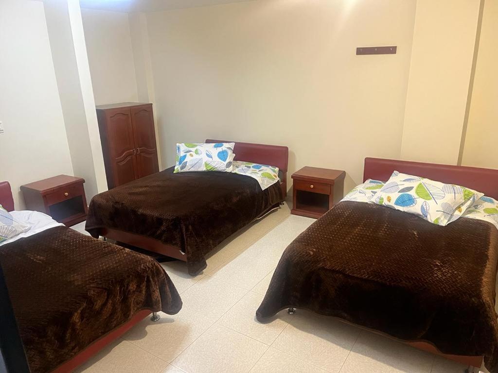 Postel nebo postele na pokoji v ubytování Hotel Vigua