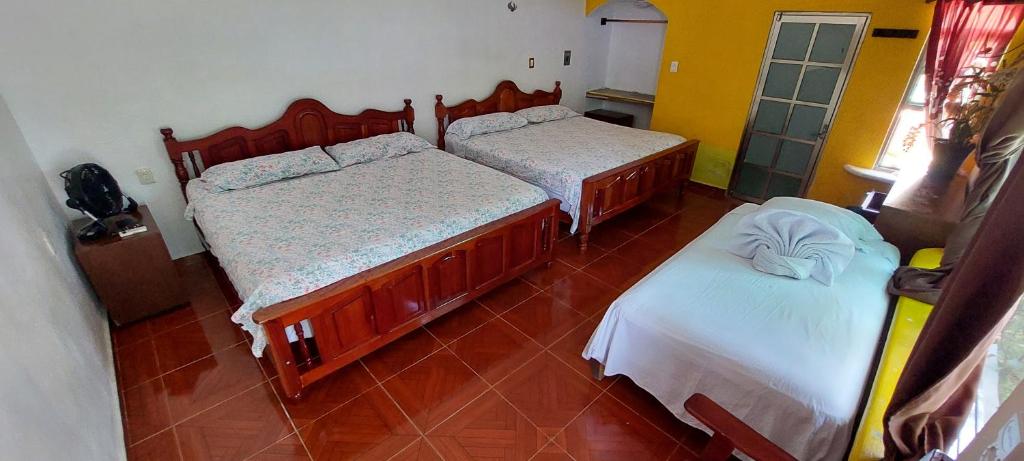 Postel nebo postele na pokoji v ubytování Casa CheJum Bacalar