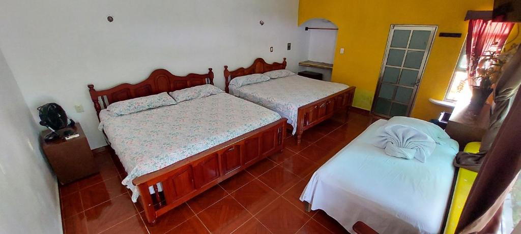 Postel nebo postele na pokoji v ubytování Casa CheJum Bacalar