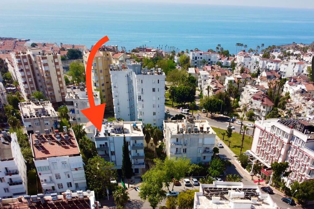 an aerial view of a city with an orange arrow at Denize 400 metre, Özel Bahçeli in Antalya
