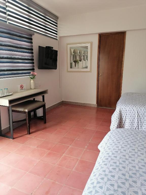 Postel nebo postele na pokoji v ubytování Casa Massima Hotel