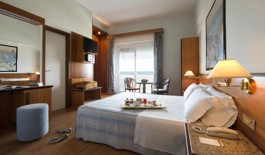 Postel nebo postele na pokoji v ubytování Hotel Giulia
