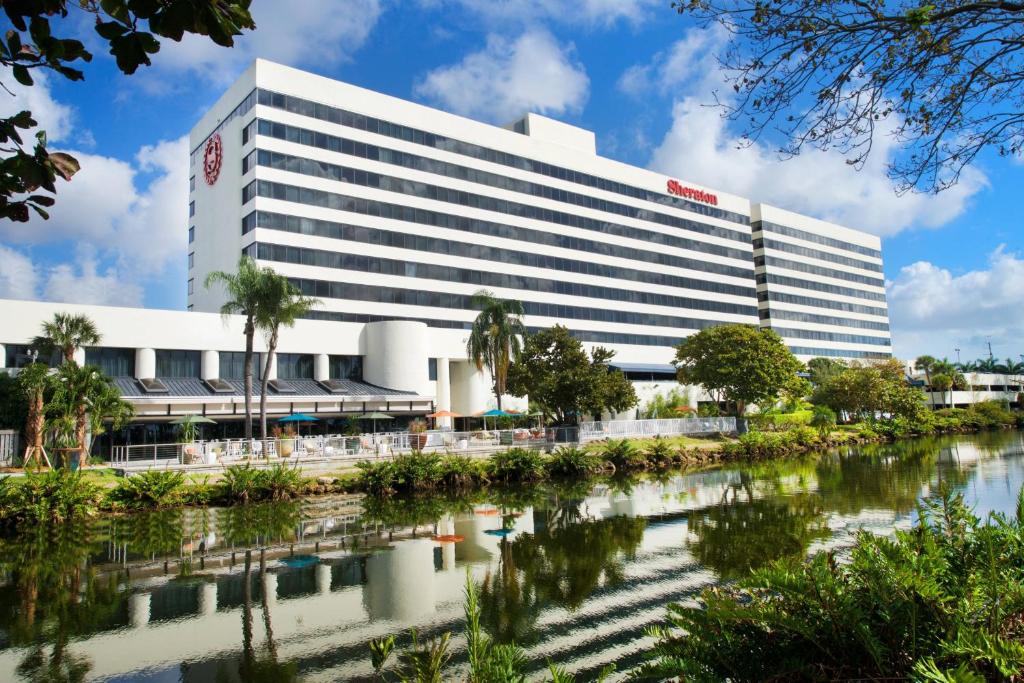 a building with a river in front of it at Sheraton Miami Airport Hotel and Executive Meeting Center in Miami