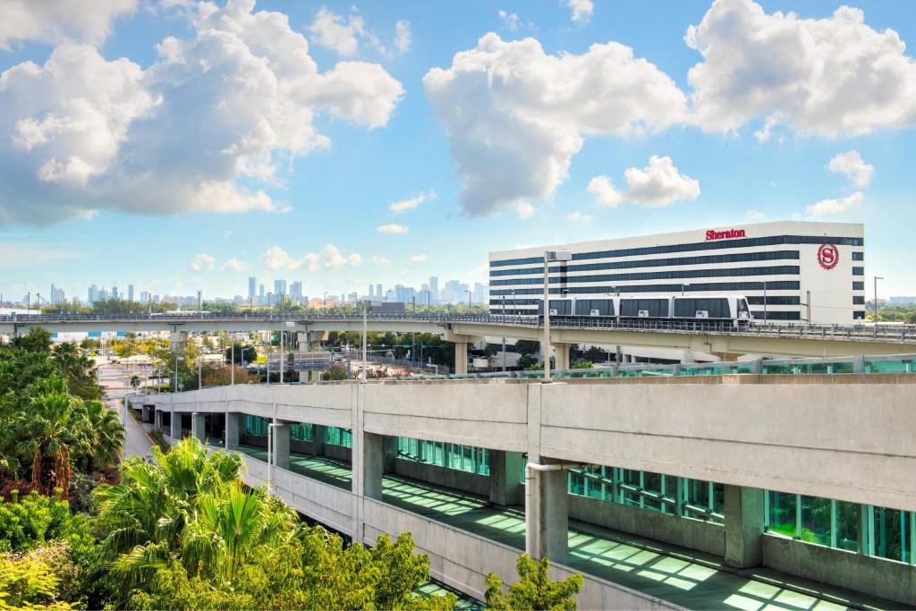 an office building with a bridge in the background at Sheraton Miami Airport Hotel and Executive Meeting Center in Miami