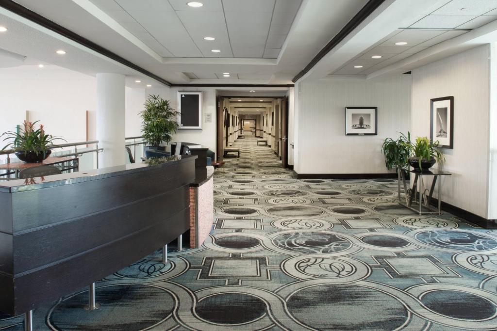 a lobby with a tile floor and a hallway at Sheraton Miami Airport Hotel and Executive Meeting Center in Miami