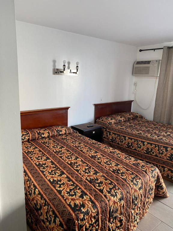 Postel nebo postele na pokoji v ubytování Dry Dock Motel