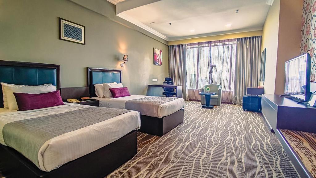 Postel nebo postele na pokoji v ubytování New York Hotel