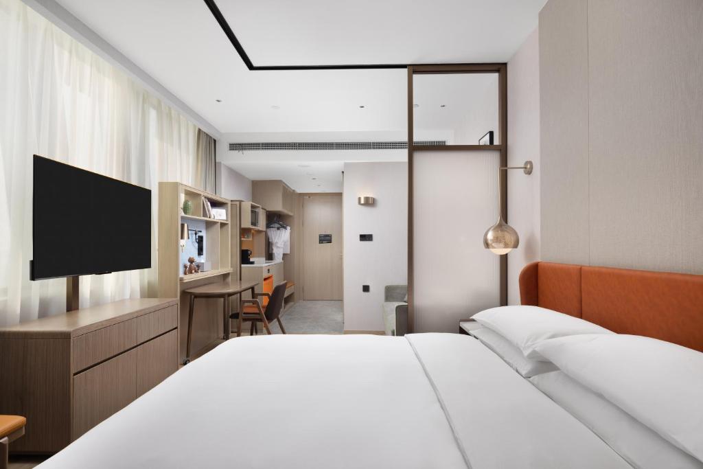 Postel nebo postele na pokoji v ubytování Home2 Suites by Hilton Beijing Shunyi