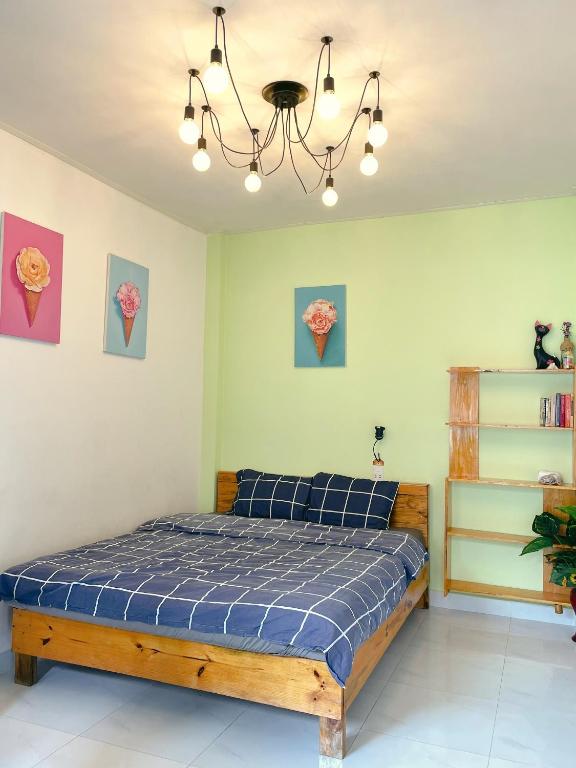 Postel nebo postele na pokoji v ubytování Da Lat Lemongrass - Đà Lạt Sả