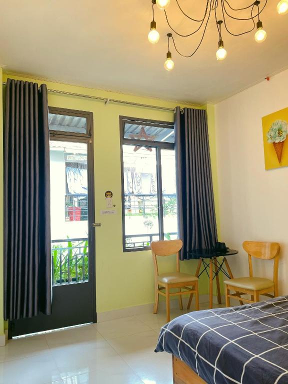 Postel nebo postele na pokoji v ubytování Da Lat Lemongrass - Đà Lạt Sả