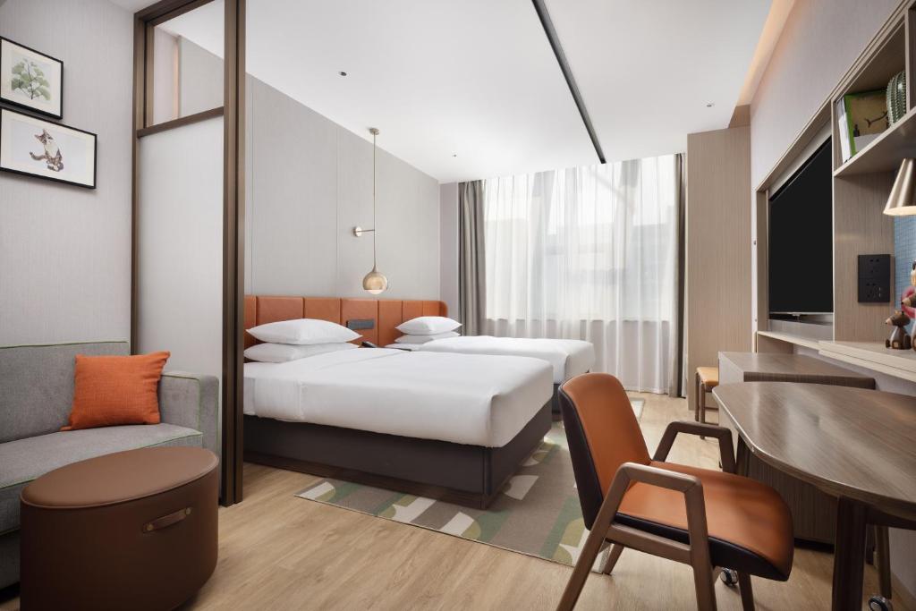 Postel nebo postele na pokoji v ubytování Home2 Suites by Hilton Beijing Shunyi