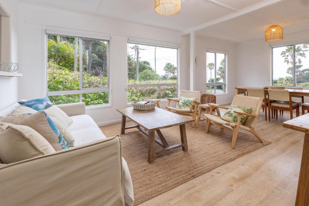 a living room with a couch and a table at Trade Winds in Elizabeth Beach