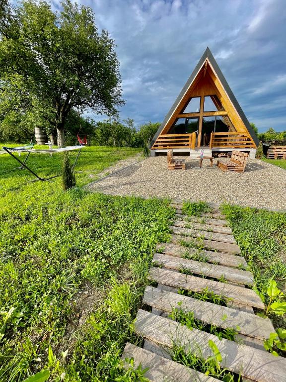 a small cabin with a stone path leading to it at Cabana VP 