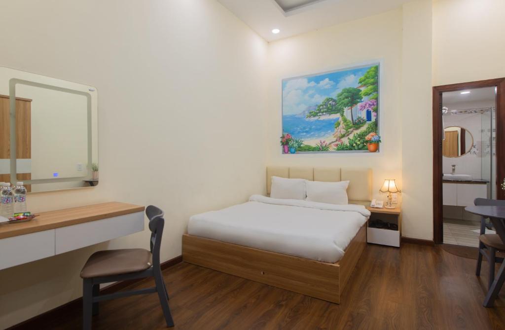 Postel nebo postele na pokoji v ubytování Tasme Hotel