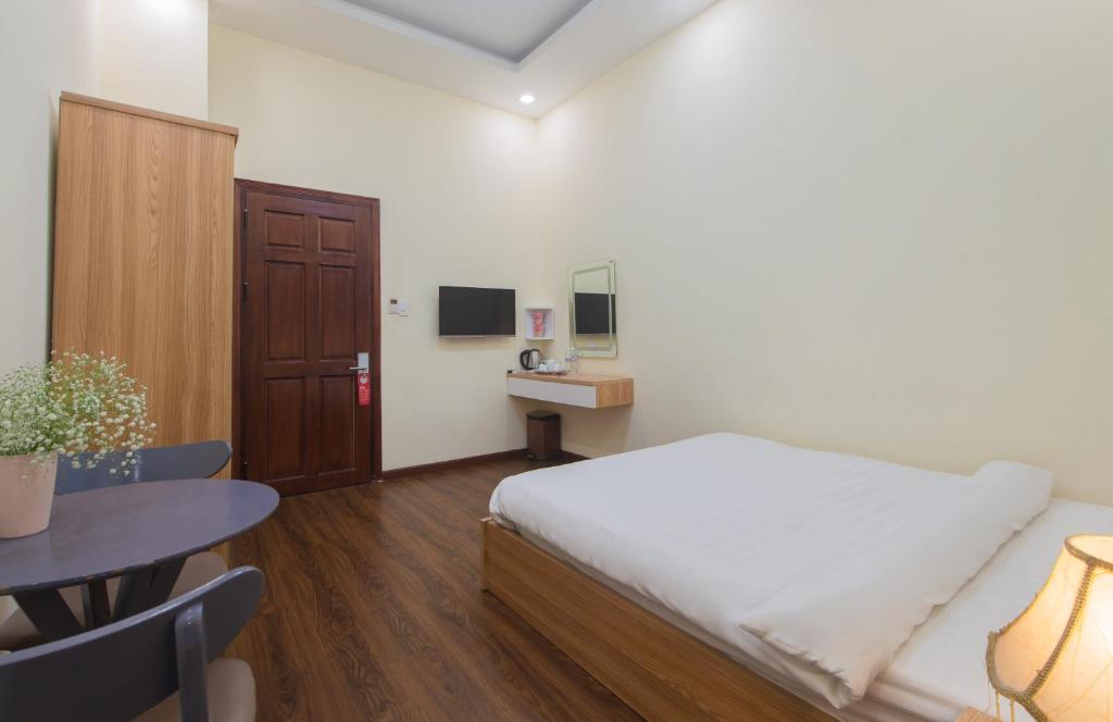 Postel nebo postele na pokoji v ubytování Tasme Hotel