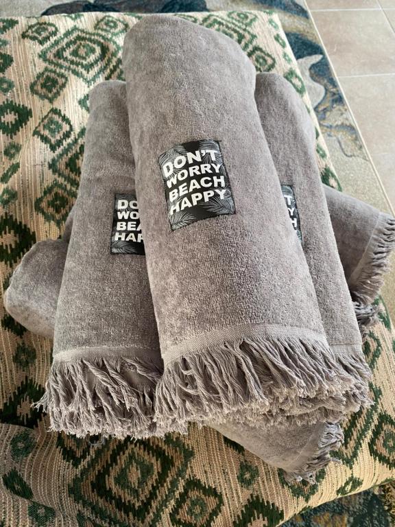 a towel with a sticker on it sitting on a rug at Casa Christiana, Lardos in Lartos