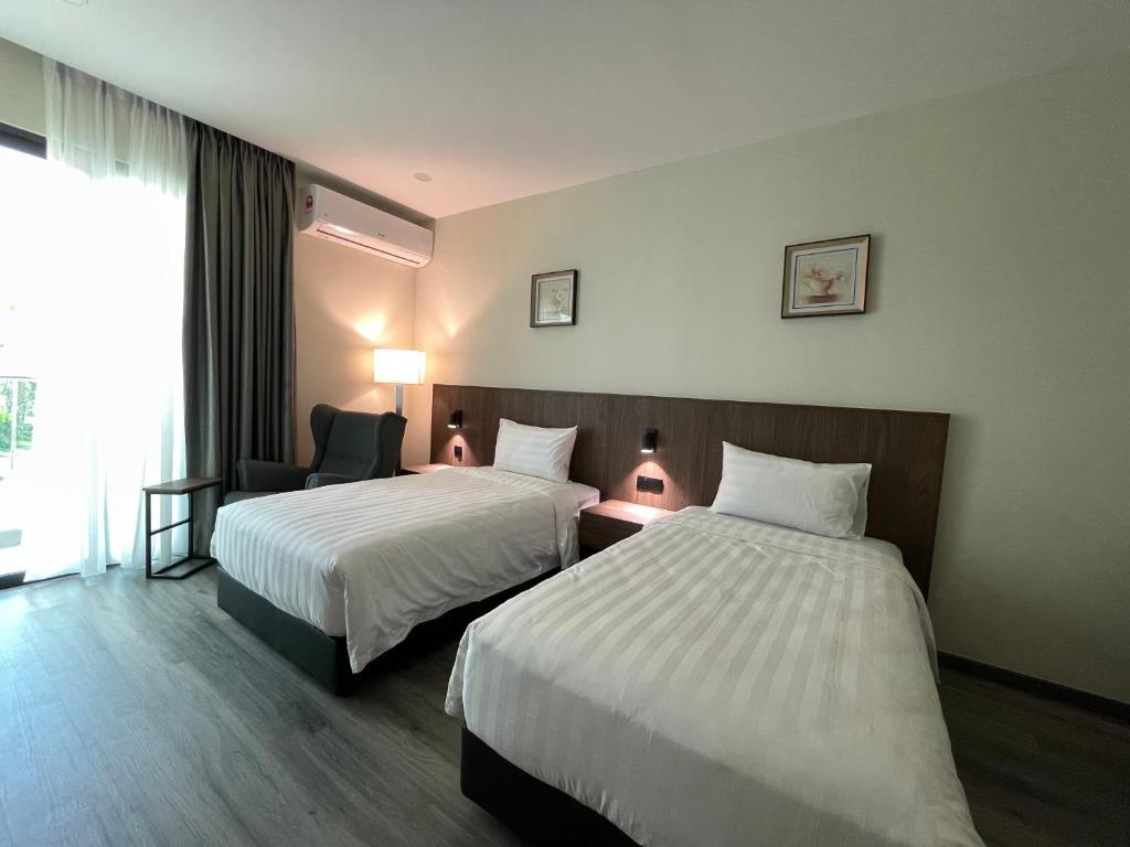 Postel nebo postele na pokoji v ubytování Hotel Bundusan