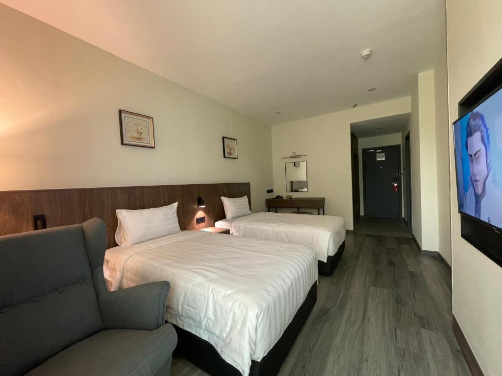 Postel nebo postele na pokoji v ubytování Hotel Bundusan