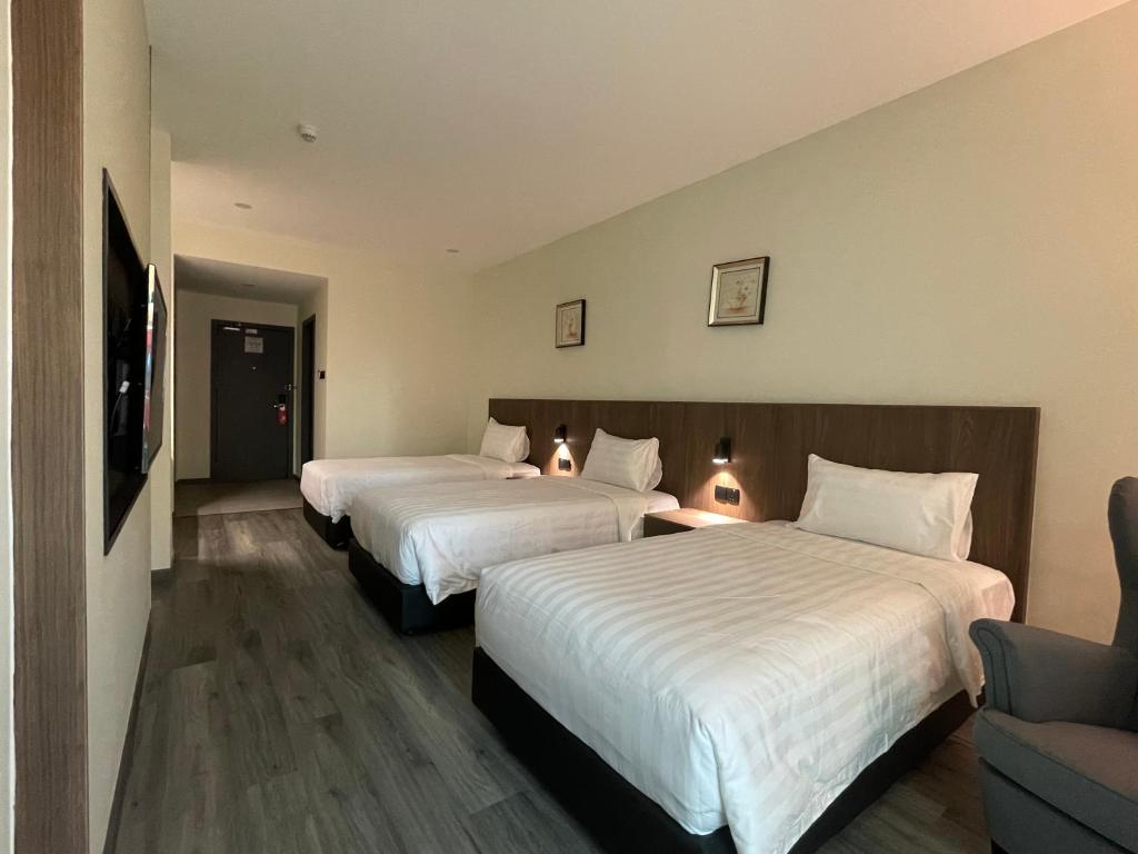 Postel nebo postele na pokoji v ubytování Hotel Bundusan