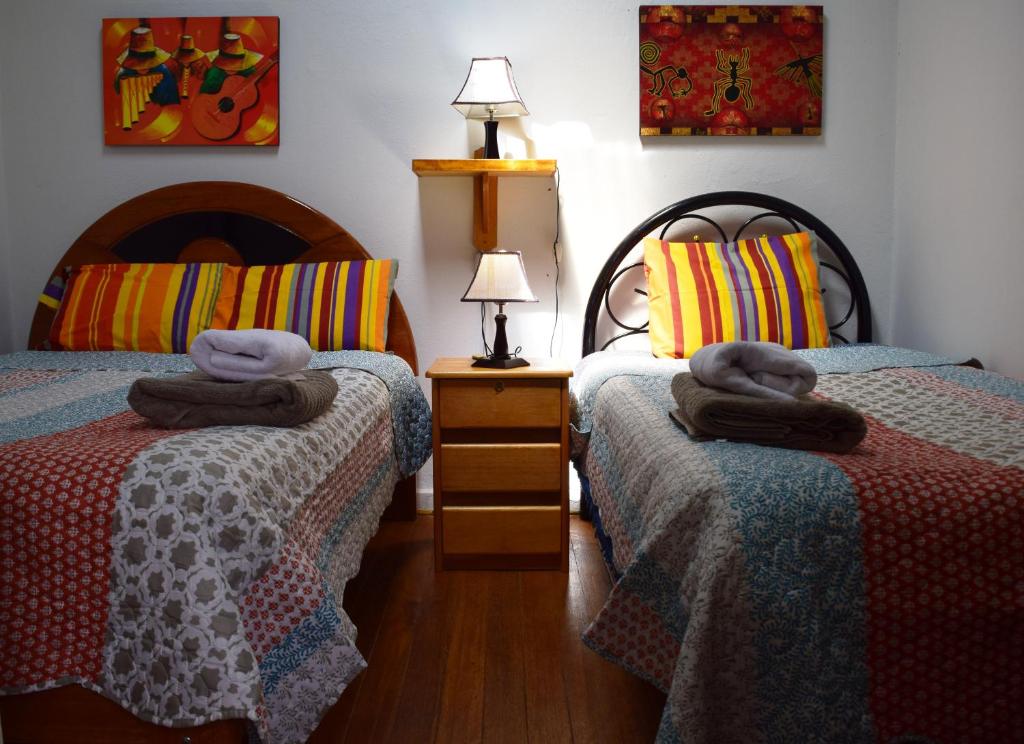 Letto o letti in una camera di Carlos Guest House 2 Cusco