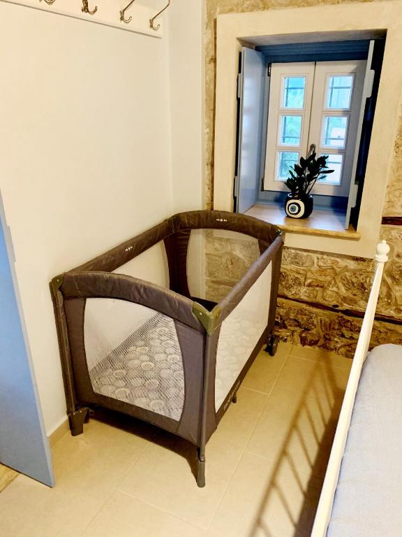 Postel nebo postele na pokoji v ubytování Kranidi House.