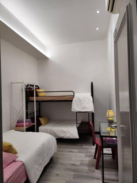 Postel nebo postele na pokoji v ubytování One Point Inn King Centre