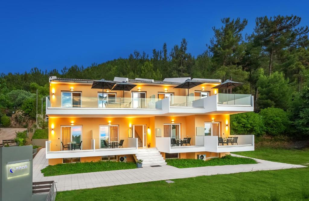 a large house with lights on top of it at LUNAR in Skala Rachoniou