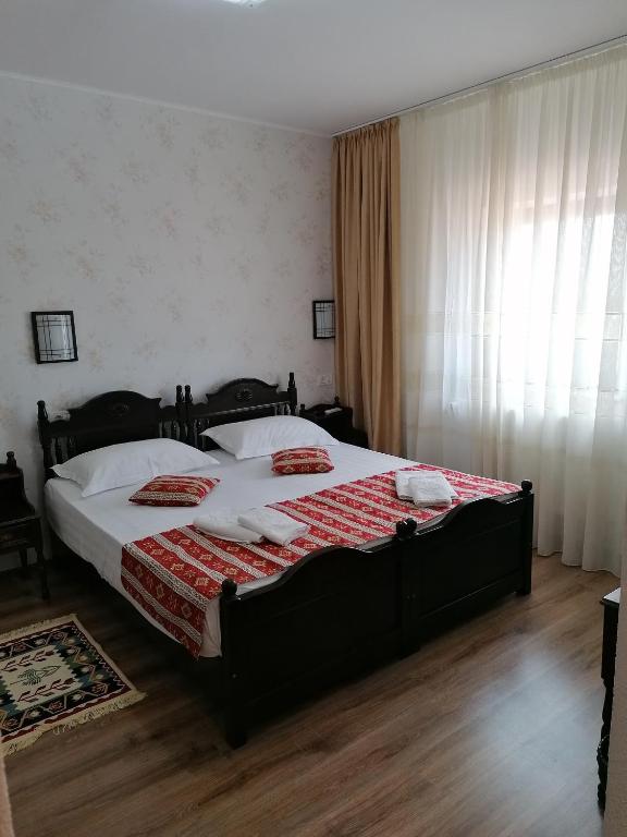 Postel nebo postele na pokoji v ubytování Hanul Hora Romaneasca