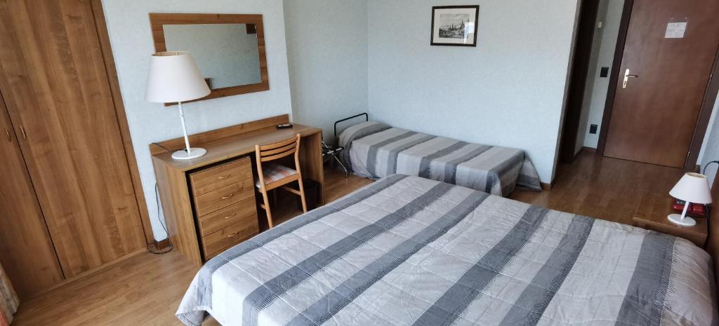 Postel nebo postele na pokoji v ubytování Hotel Nike