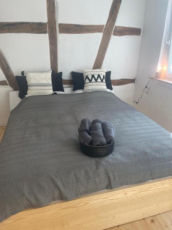 a bed with a bowl on top of it at GetAway in Eberbach im Odenwald nahe Heidelberg in Eberbach