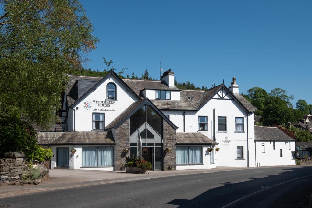 a large white building on the side of a street at The Windermere Rooms at The Wateredge Inn, Ambleside in Ambleside