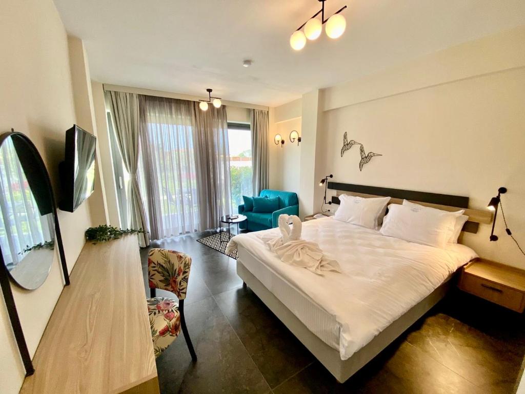 Posteľ alebo postele v izbe v ubytovaní Miroes Suites