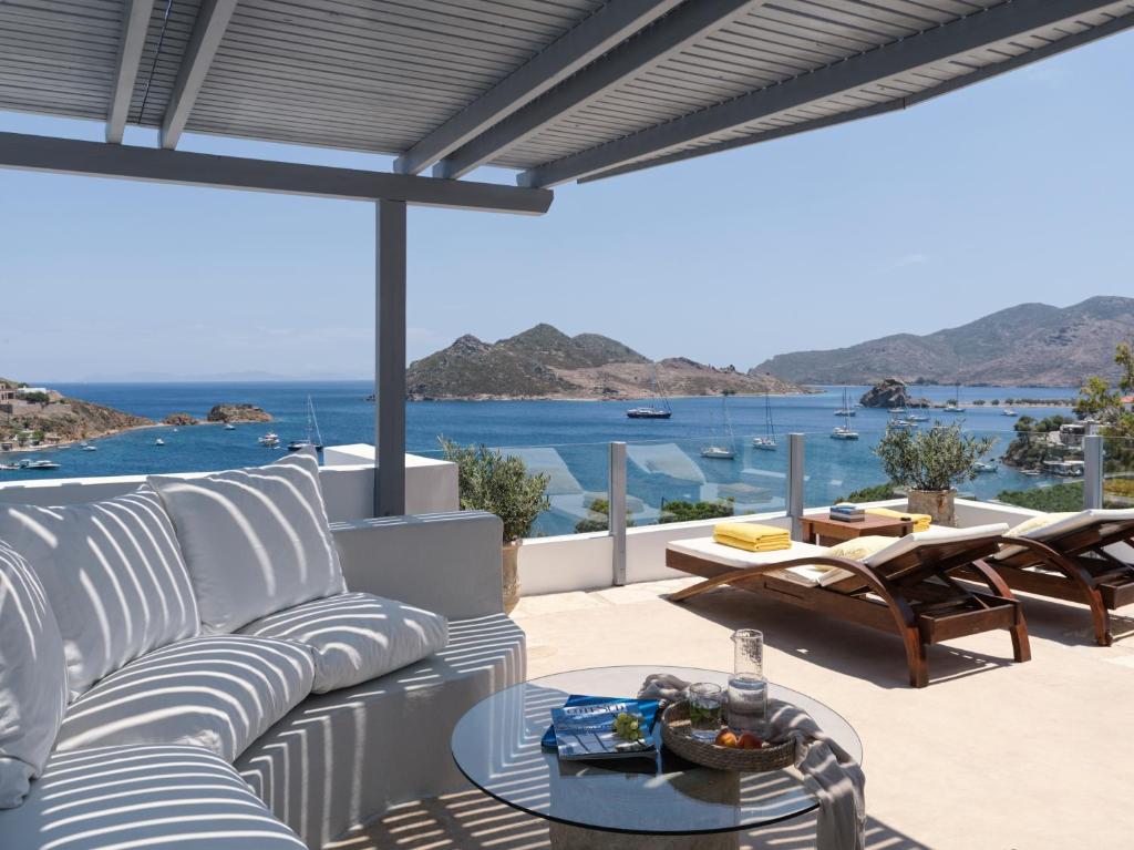 a patio with a couch and a table at The Petra in Patmos