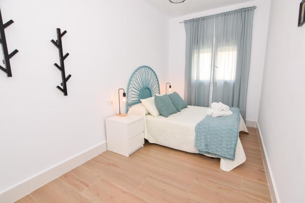 Postel nebo postele na pokoji v ubytování Apartamentos Atlantida