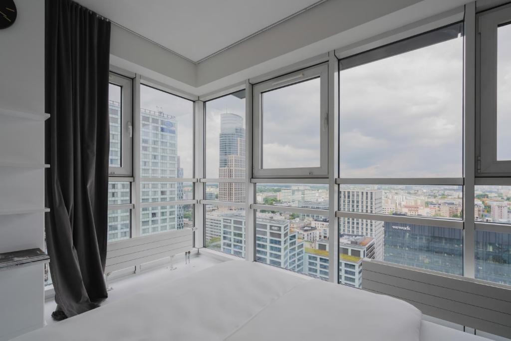 Postel nebo postele na pokoji v ubytování J&K Platinum Towers