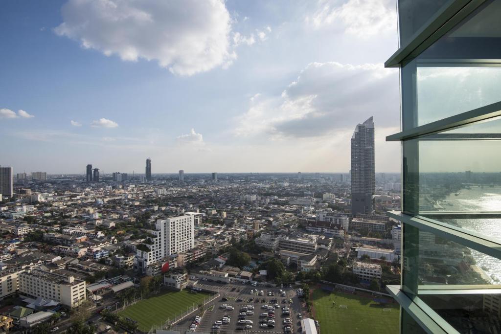 a view of a city from a building at Chatrium Hotel Riverside Bangkok in Bangkok