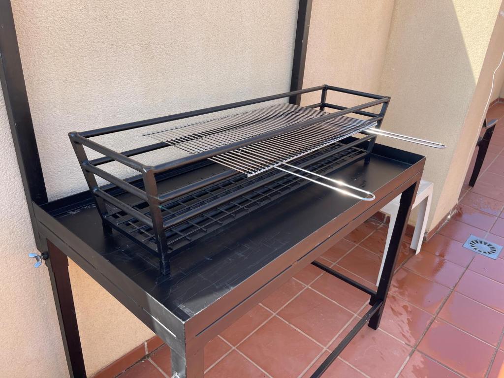 Łóżko lub łóżka piętrowe w pokoju w obiekcie Atico penthouse