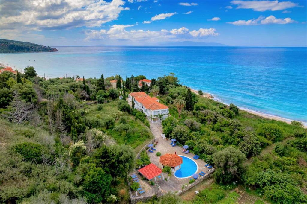 an aerial view of a villa with a resort and the ocean at Vivian Apartments in Vlachata